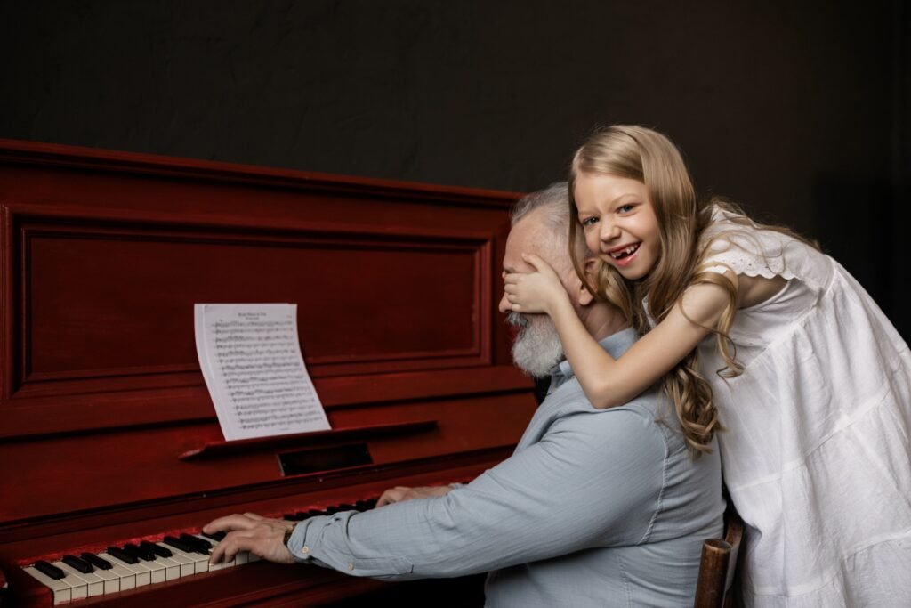 Joyful moment as granddaughter surprises grandfather at the piano, surrounded by love and music.